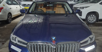 Luxury BMW Car by One Side Taxi
